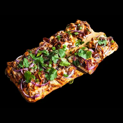 Chicken, mozzarella cheese, sweet and tangy BBQ sauce, red onions garnished with cilantro