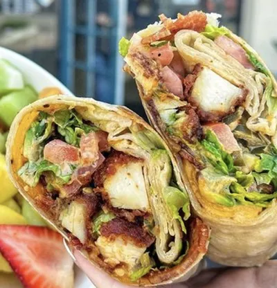 Panko-battered antibiotic-free chicken breasts, thick-cut bacon, vermont cheddar cheese, sliced avocado, shredded romaine lettuce, chopped jalapeños, chipotle aioli, roma tomatoes in a flour tortilla.