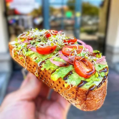 Toasted rye bread, avocado, sliced heirloom tomato, pickled red onions, sprouts, Balsamic glaze