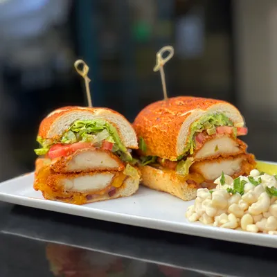 2 Japanese Panko-battered antibiotic-free chicken breasts, thick-cut bacon, Boar’s Head Vermont cheddar cheese, sliced avocado, shredded Romaine lettuce, chopped jalapeños, Roma tomatoes on a toasted Dutch crunch roll.