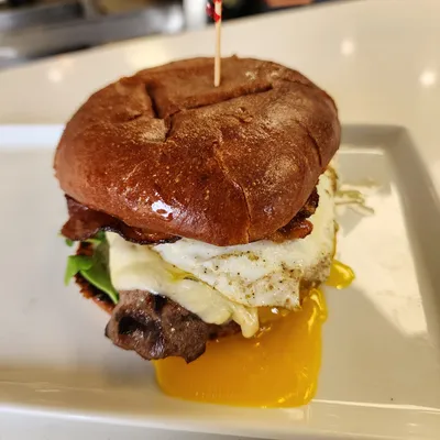 Brioche bun, peppercorn aioli, filet mignon, thick-cut bacon, sunny-side up egg, Havarti cheese, arugula