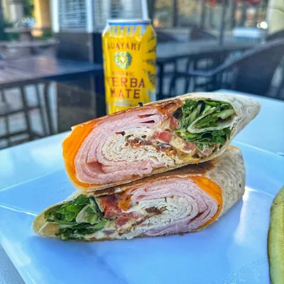 Flour tortilla, mayo, dijon mustard, turkey, ham, thick-cut bacon, roma tomatoes, american cheddar cheese, spring mix.